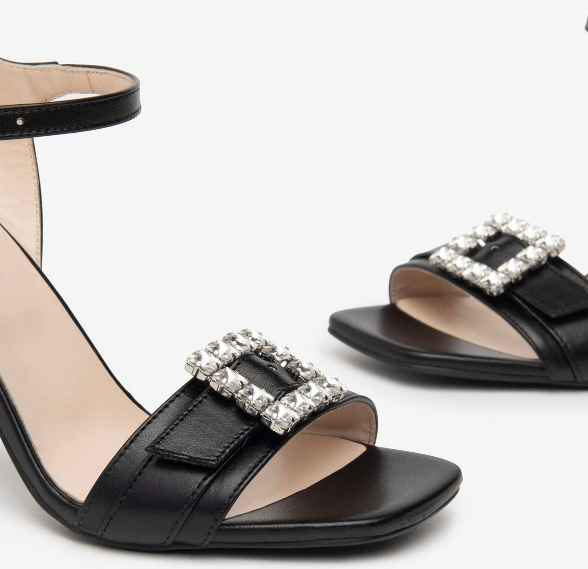 Nerogiardini black leather sandals with diamond detail buckle