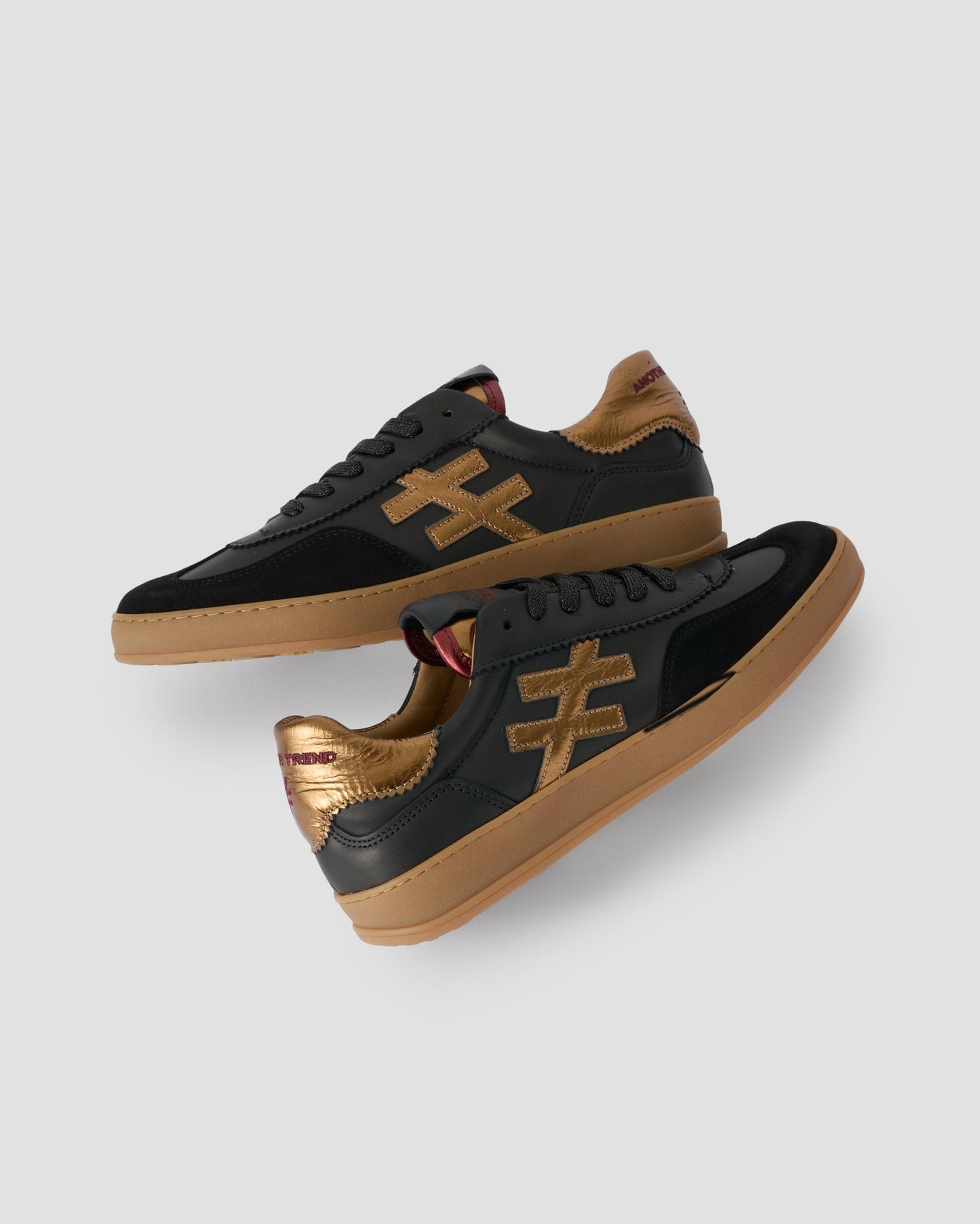 Another Trend black and gold leather and suede sneakers