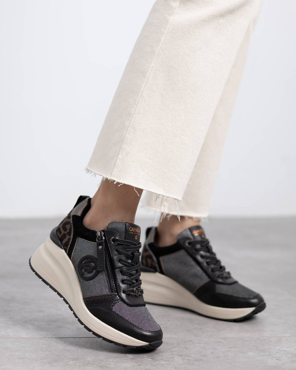 Carmela black leather wedge sneakers