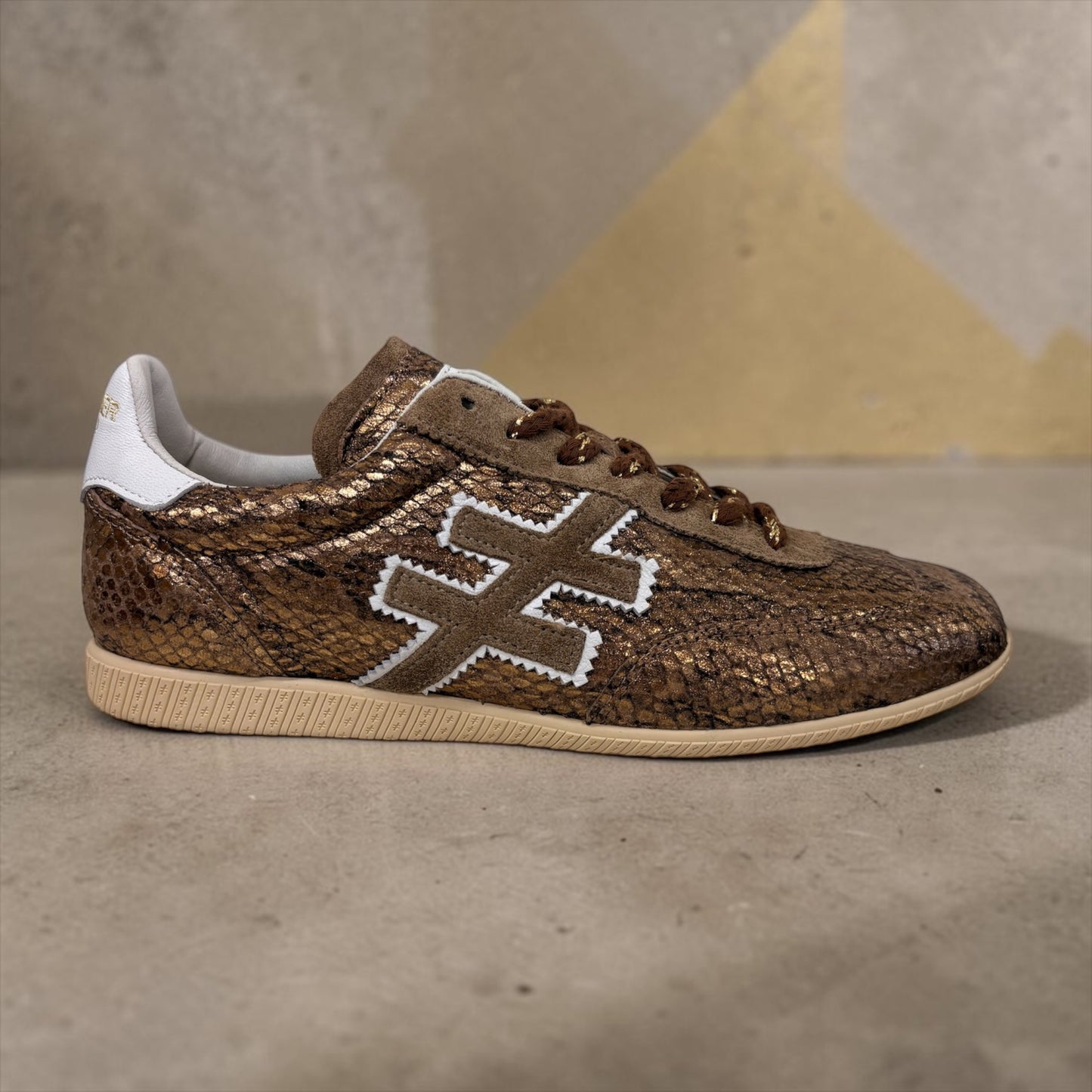 ANOTHER TREND gold snakeskin sneaker