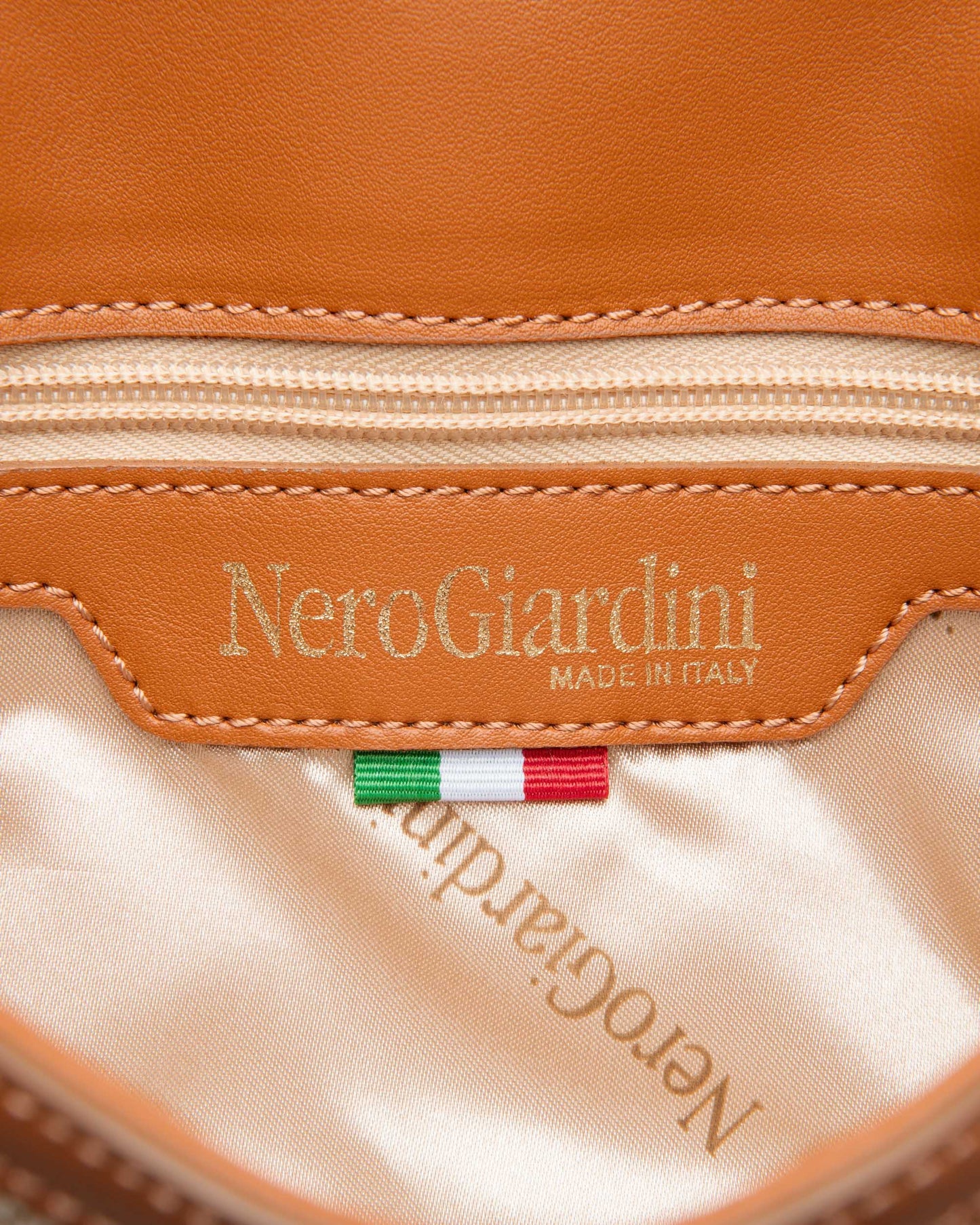 NeroGiardini beige and tan material clutch bag