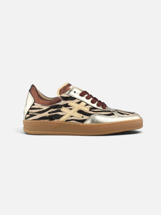 ANOTHER TREND gold zebra sneaker